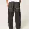 Verwaschene schwarze Skater-Baggy-Jeans mit Schlangenstickerei