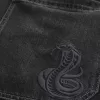 Verwaschene schwarze Skater-Baggy-Jeans mit Schlangenstickerei