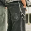 Verwaschene schwarze Skater-Baggy-Jeans mit Schlangenstickerei