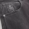 Verwaschene schwarze Skater-Baggy-Jeans mit Spielkarten-Joker-Grafik