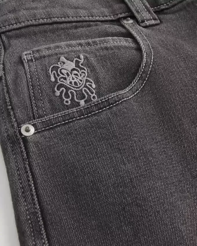 Verwaschene schwarze Skater-Baggy-Jeans mit Spielkarten-Joker-Grafik