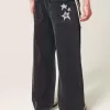 Verwaschene schwarze Super Baggy-Jeans mit Sterngrafik