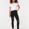 Zerrissene schwarze Jeans-Leggings mit hohem Bund