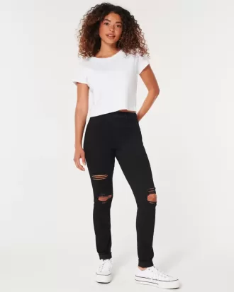 Zerrissene schwarze Jeans-Leggings mit hohem Bund
