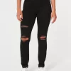 Zerrissene schwarze Jeans-Leggings mit hohem Bund