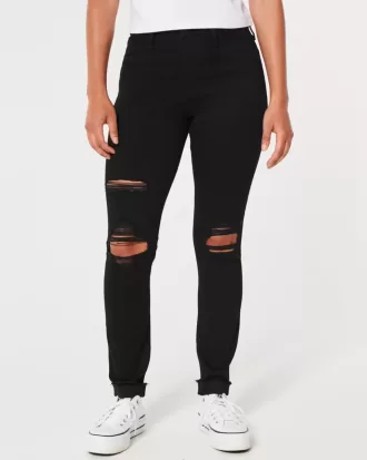 Zerrissene schwarze Jeans-Leggings mit hohem Bund