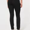 Zerrissene schwarze Jeans-Leggings mit hohem Bund