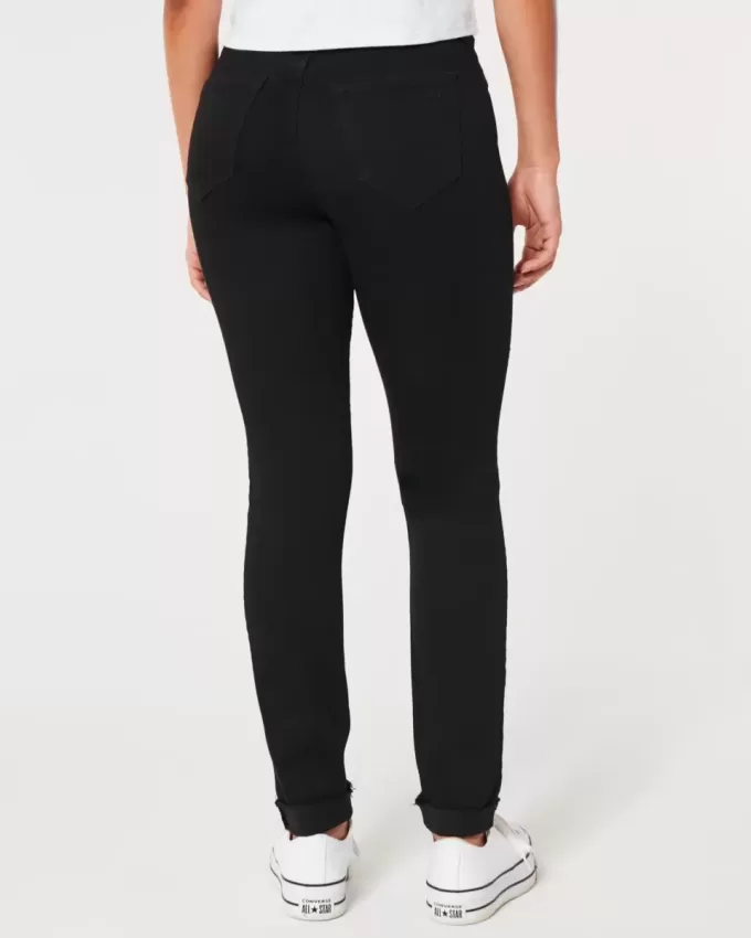 Zerrissene schwarze Jeans-Leggings mit hohem Bund