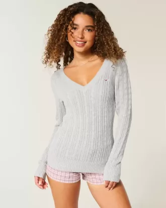 Zopfmuster-Pullover mit V-Ausschnitt und Symbol