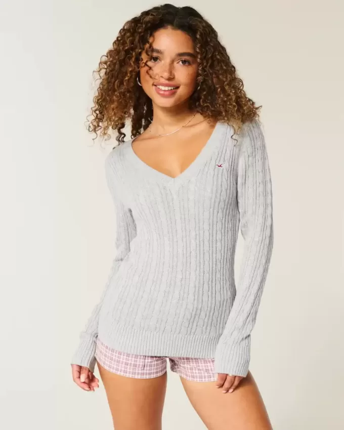 Zopfmuster-Pullover mit V-Ausschnitt und Symbol