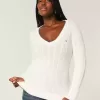 Zopfmuster-Pullover mit V-Ausschnitt und Symbol