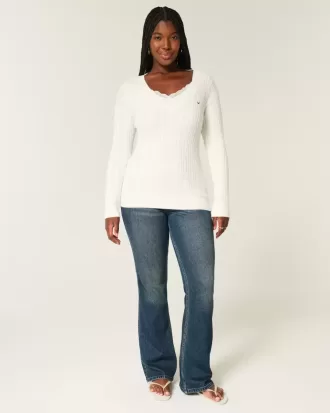 Zopfmuster-Pullover mit V-Ausschnitt und Symbol