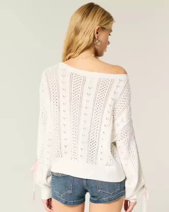 Zopfmusterpullover mit Schleifenärmeln