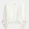 Zopfmusterpullover mit Schleifenärmeln