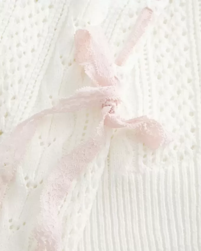 Zopfmusterpullover mit Schleifenärmeln