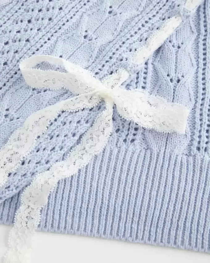 Zopfmusterpullover mit Schleifenärmeln
